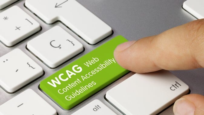 WCAG Web Content Accessibility Guidelinesと記載されたキーボードのキーを押下する様子